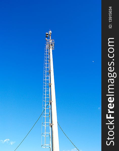 The wireless device for cellular communication(connection) on a background of the light-blue sky