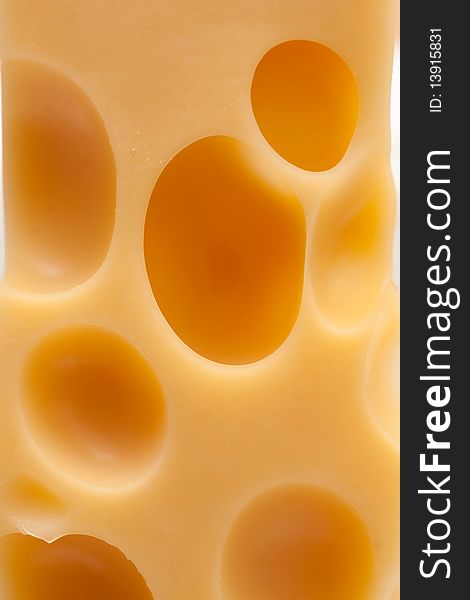 A piece of cheese with holes