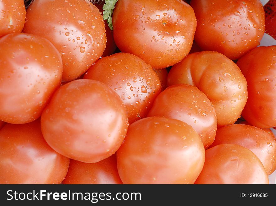 Red ripe tomato with drops