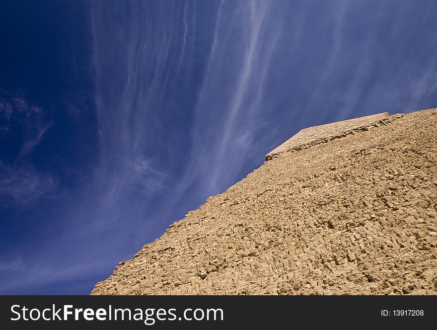 View of the summit pyramid of Egypt, against the blue sky. View of the summit pyramid of Egypt, against the blue sky