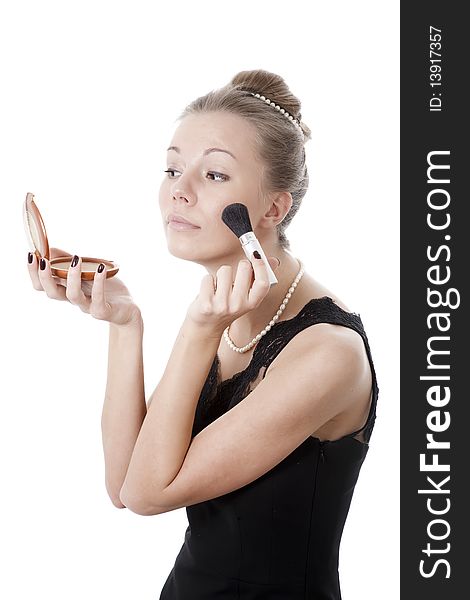 Girl with powder brush isolated on white