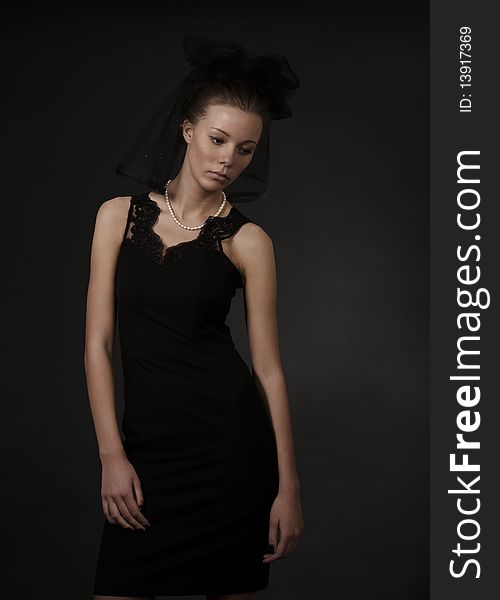 Young woman in black dress