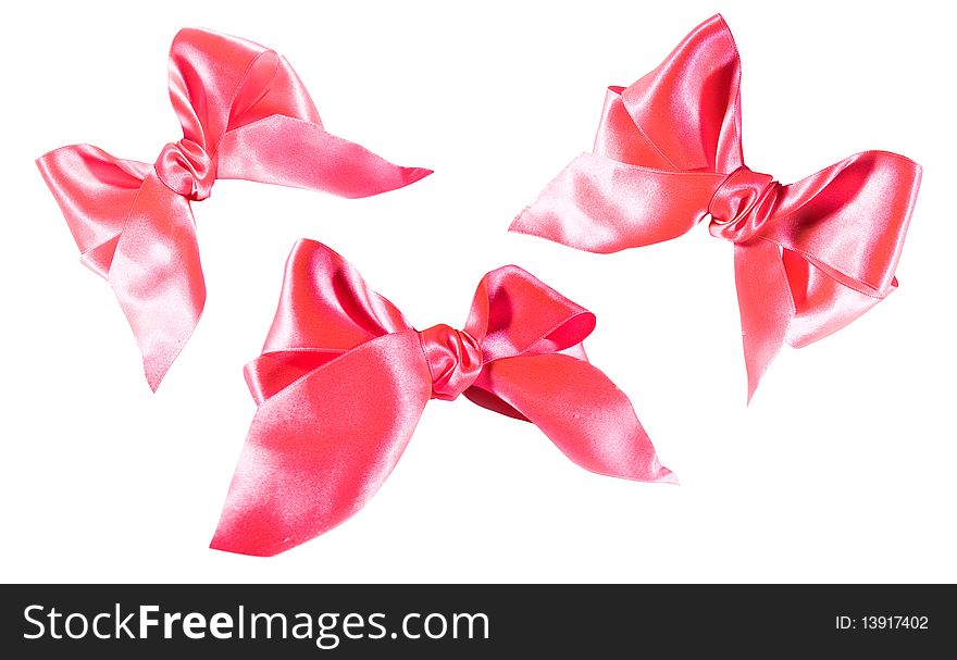 Pink bowknots isolated over  white
