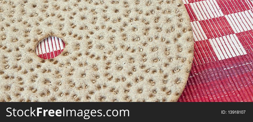 Swedish bread on colorful red, white checked textile. Swedish bread on colorful red, white checked textile