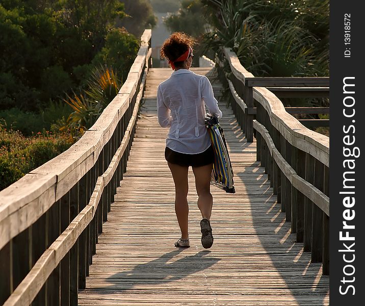 Woman walking on footbridge