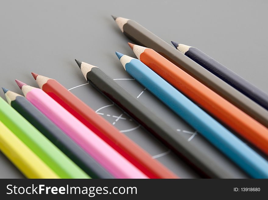 Palette of colored pencils in row