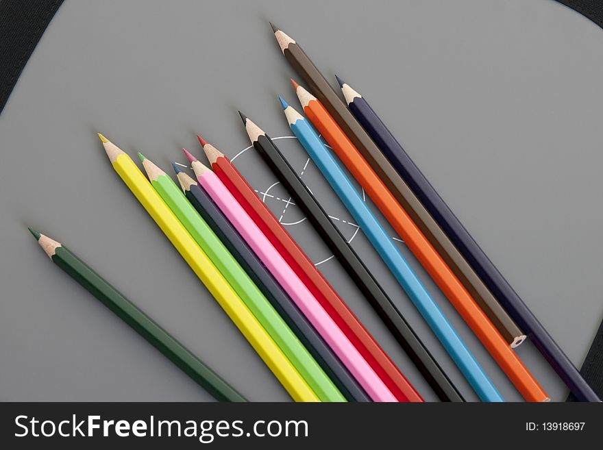 Palette of colored pencils in row