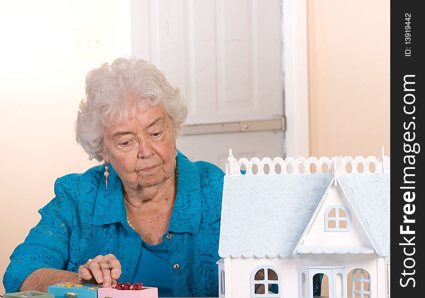 Senior citizen woman working on her crafts. Senior citizen woman working on her crafts