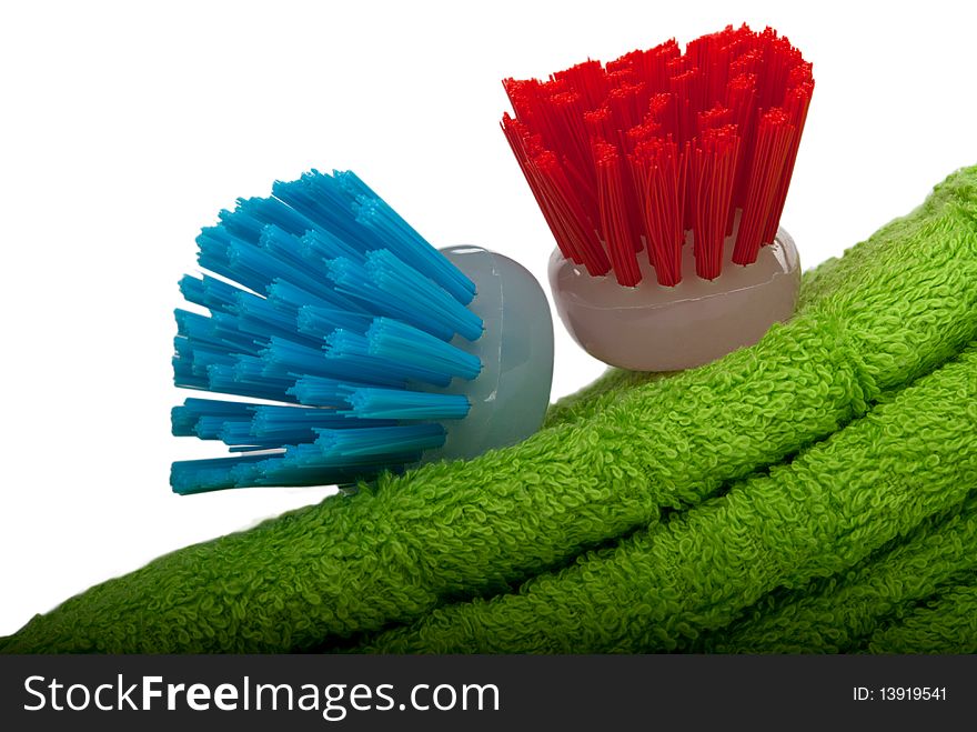 Two brushes for ware washing lie on towel