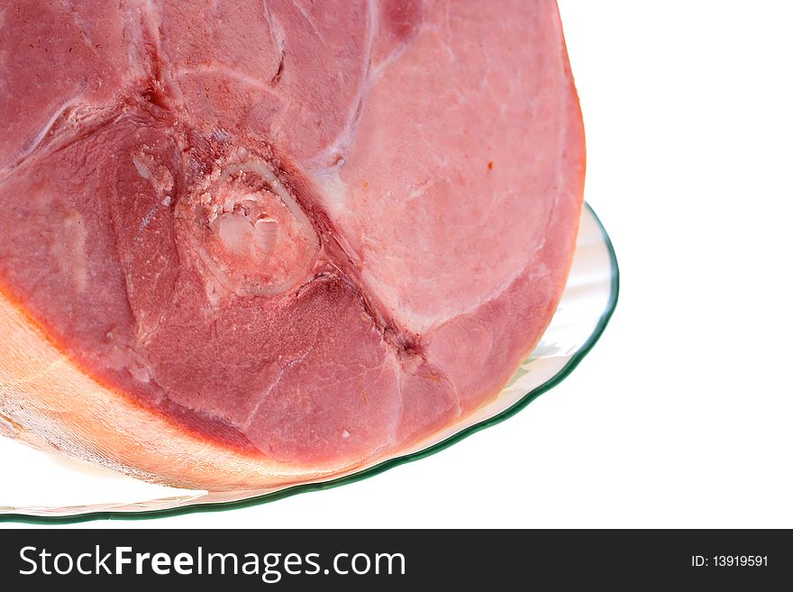 Smoked gammon on a plate, a background white.