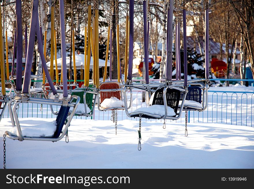 Forgotten swings in the winter park