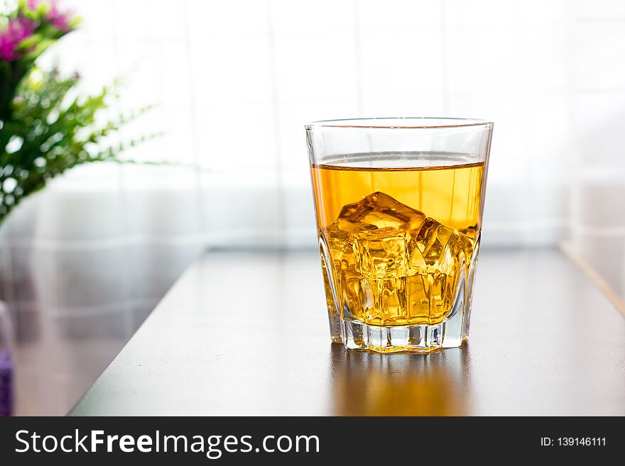 Glass Of Tea On The Table Background