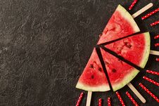 Sliced Juicy Watermelon On Textured Concrete Background With Copy Space. Royalty Free Stock Photos