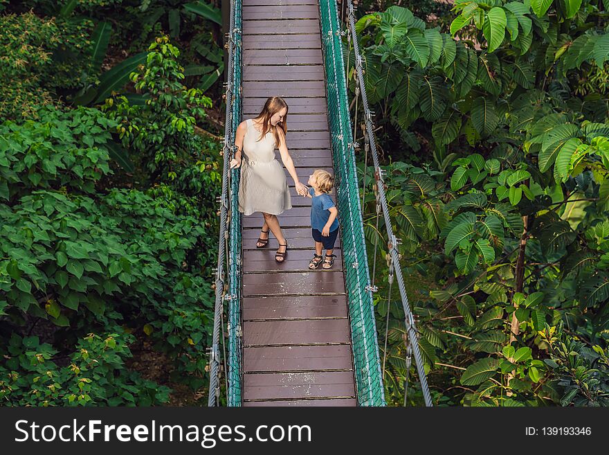 Mother and son at the Suspension bridge in Kuala Lumpur, Malaysia