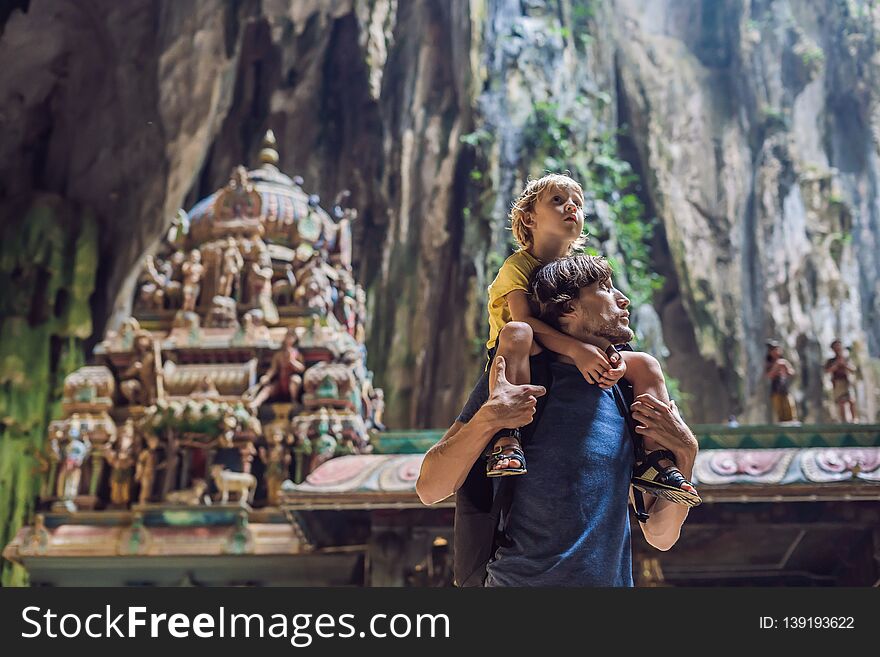 Father and son in the background of Batu Caves, near Kuala Lumpur, Malaysia. Traveling with children concept