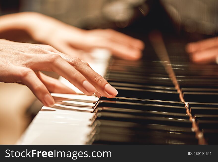Beautiful Piano Melody...Close up view of female hands playing on piano her favorite classical music