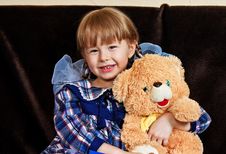 Little Girl Embraces Bear Cub Royalty Free Stock Photography Little Girl Embraces Bear Cub Royalty Free Stock Photography