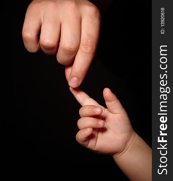 Hands. loving touch of father and son