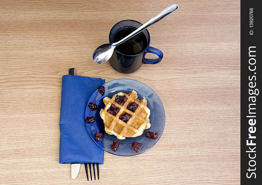 Black tea and yummy jam waffle for breakfast. Black tea and yummy jam waffle for breakfast