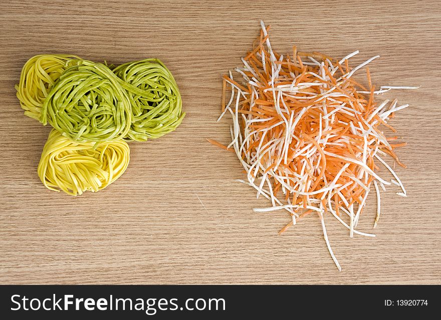 Homemade pasta and freshly cut vegetables for salad. Homemade pasta and freshly cut vegetables for salad