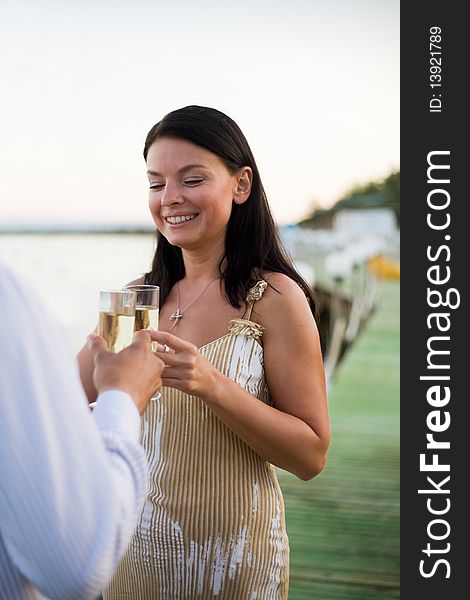 Young couple toasting champagne glasses. Young couple toasting champagne glasses.