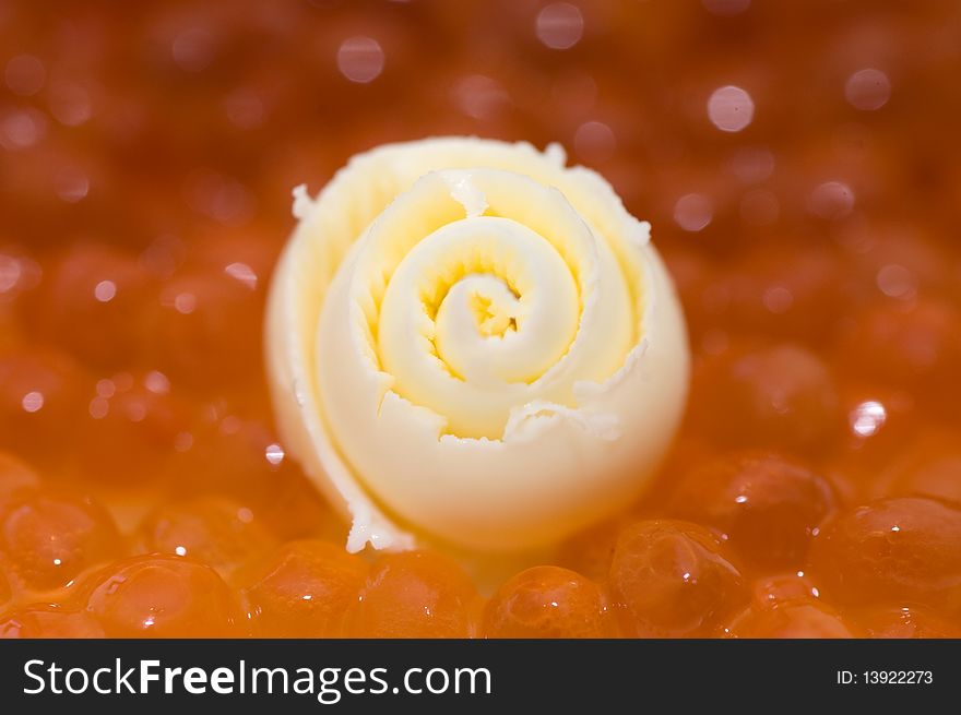 Slice of a butter and caviar close up