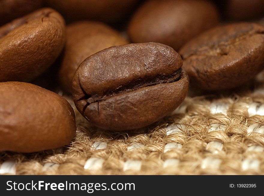 Coffee bean on sacking close up