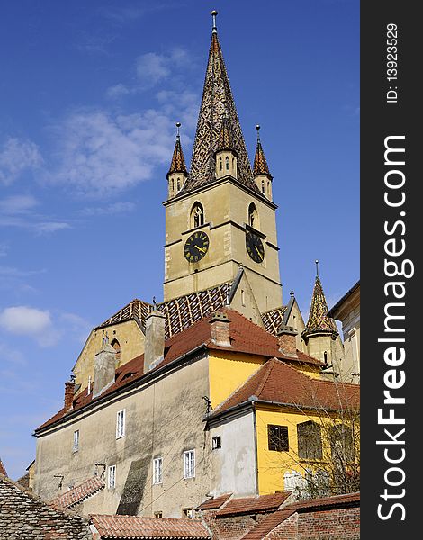 One old building towers with blue sky in background. One old building towers with blue sky in background