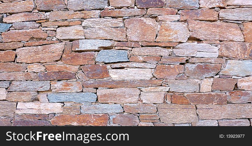 Close up of a red and grey colored brick wall