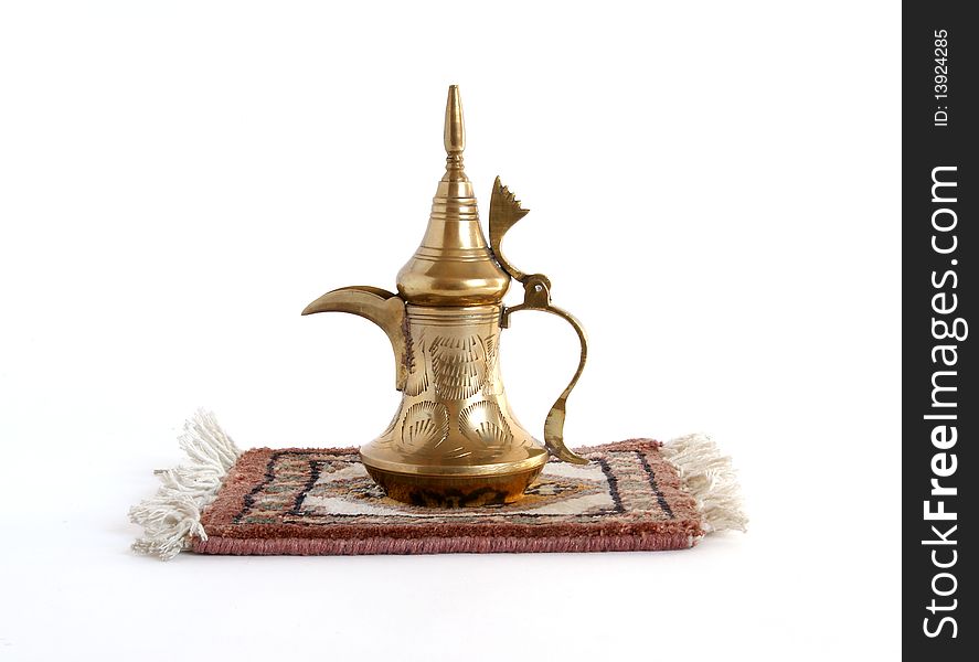 Traditional Turkish jug of copper on the carpet, isolation