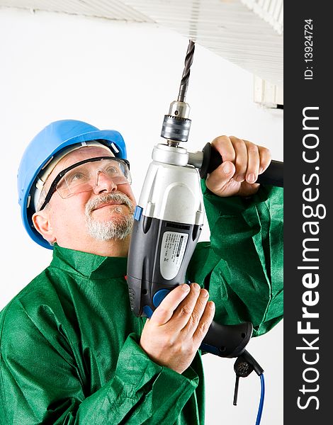 Construction worker holding the electric hand drill. Construction worker holding the electric hand drill