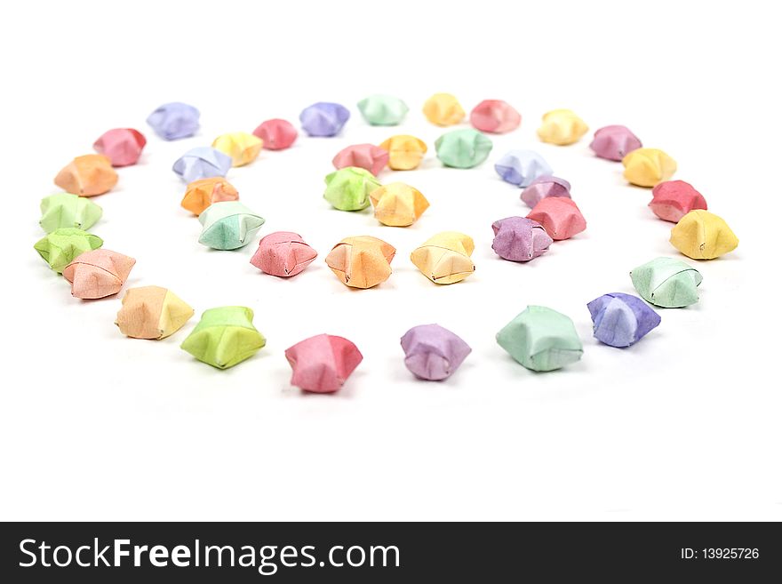 Color lucky stars origami spiral on white background