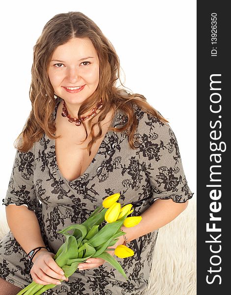A pregnant woman with yellow tulips