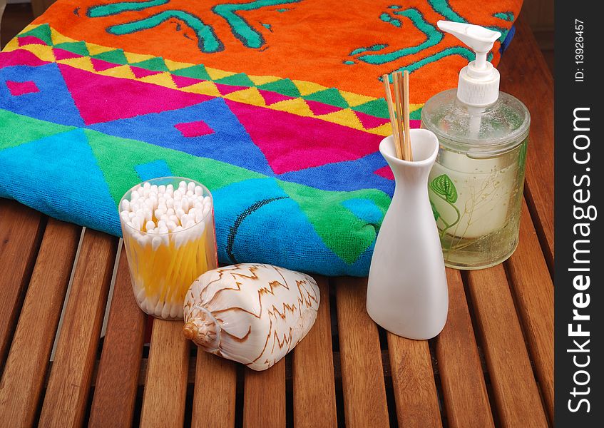 Spa concept of brown color: the towel, soap and candles over sisal background