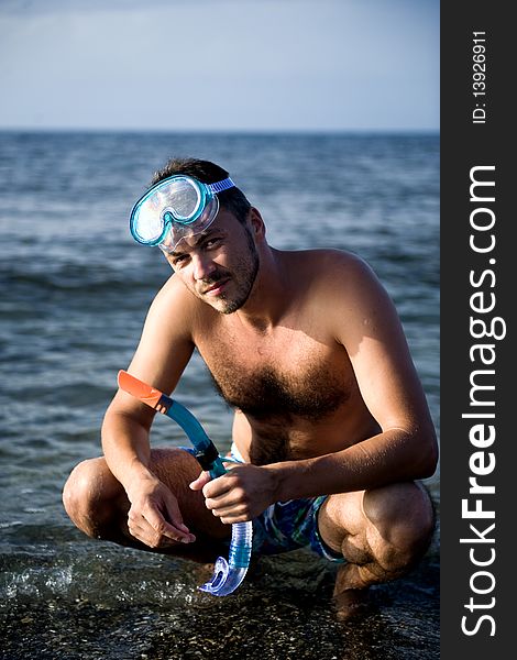 Young summer diving man with swimming mask