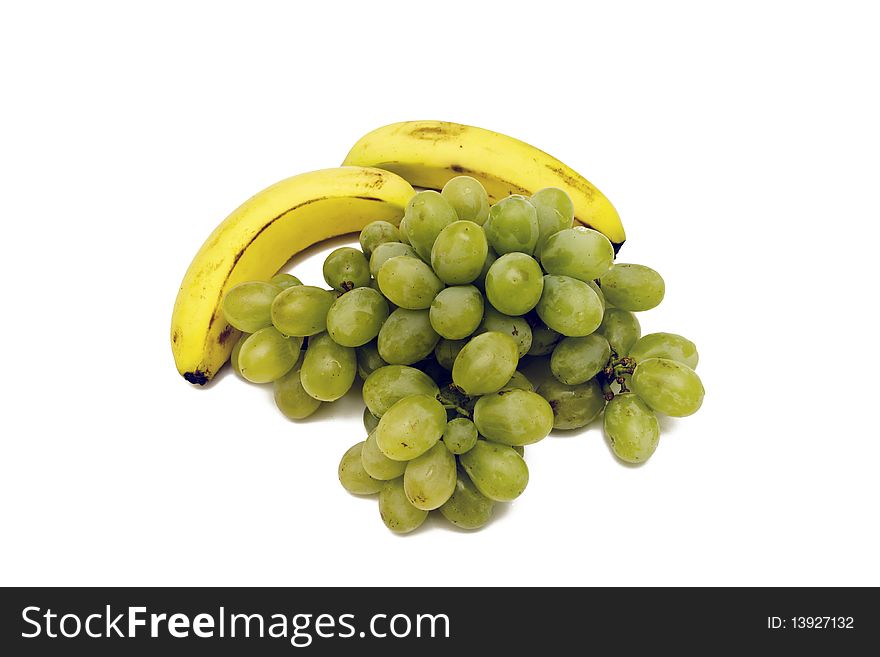 White grapes and bananas isolated on a white background