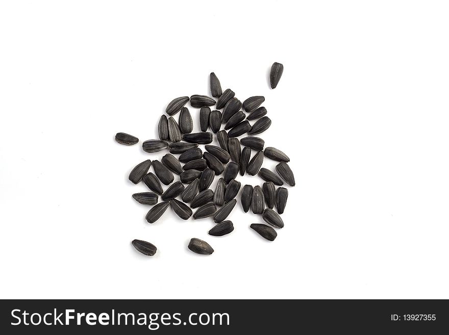 Heap of sunflower seeds on a white background. Heap of sunflower seeds on a white background
