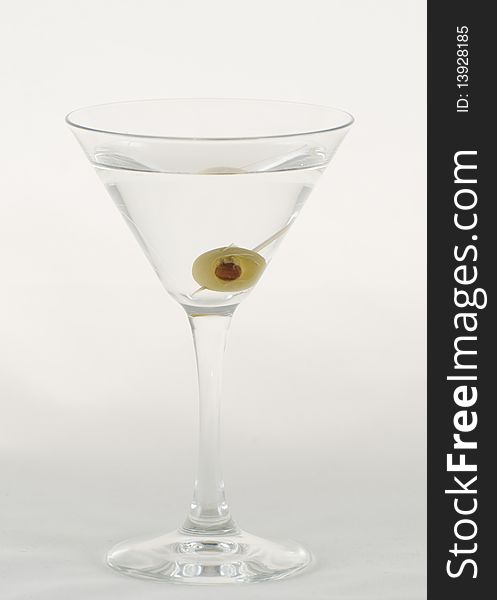 A dry Martini with an olive in it.