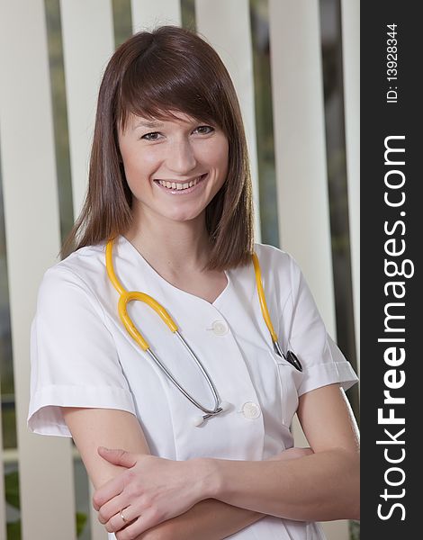 Portrait of smiling female doctor in the medical office