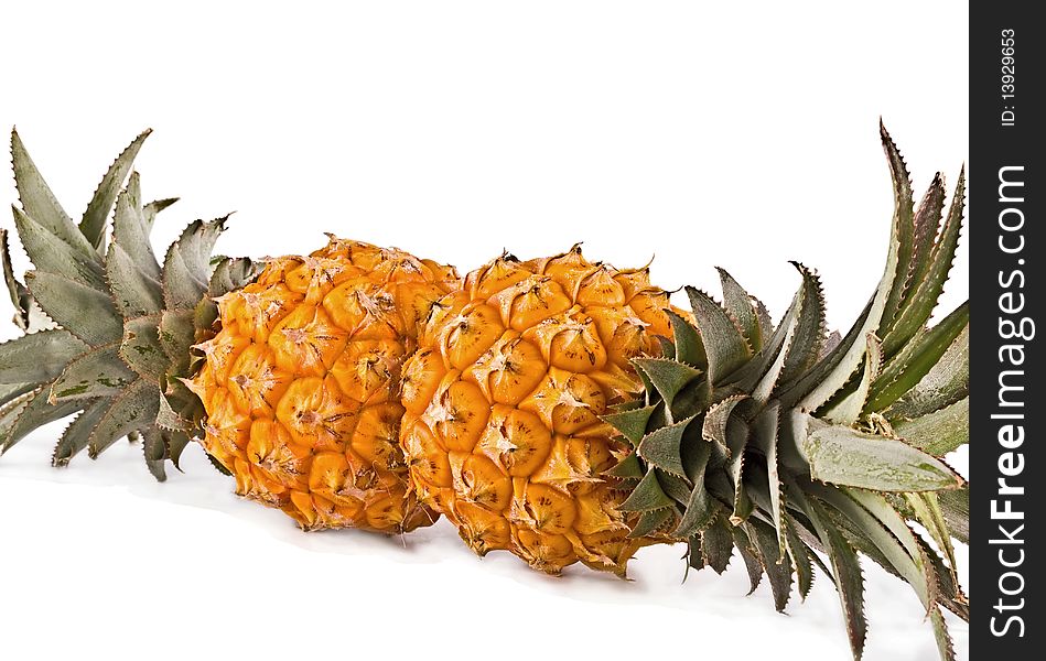 Pair pineapple cut on a white