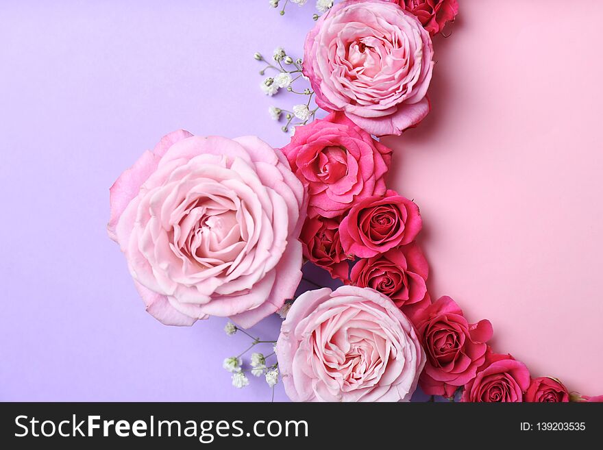 Flat lay composition with flowers and space for text on color background
