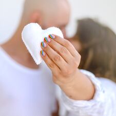 Young Copule Kissing And Holding White Felted Heart. Love, Valentine, Lgbt, Pride Concept Stock Photos