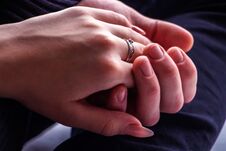 Girl`s Hand In The Hand Of A Guy Close-up Royalty Free Stock Photos