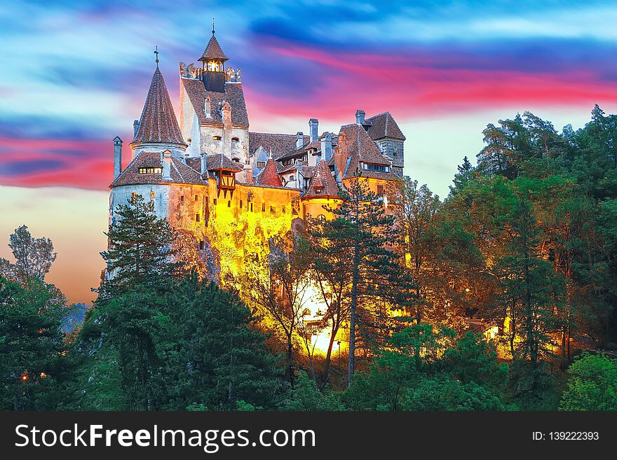 Landscape with medieval Bran castle known for the myth of Dracula at sunset, Brasov landmark, Transylvania, Romania, Europe