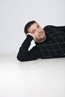 Free Attractive Man Sitting On Wooden Floor Stock Photography - 13939042