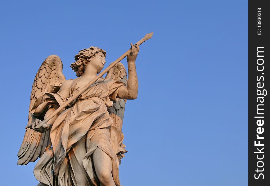 Famous sculpture of Angel with the Lance. Sant Angelo Bridge. Rome. Italy. Famous sculpture of Angel with the Lance. Sant Angelo Bridge. Rome. Italy