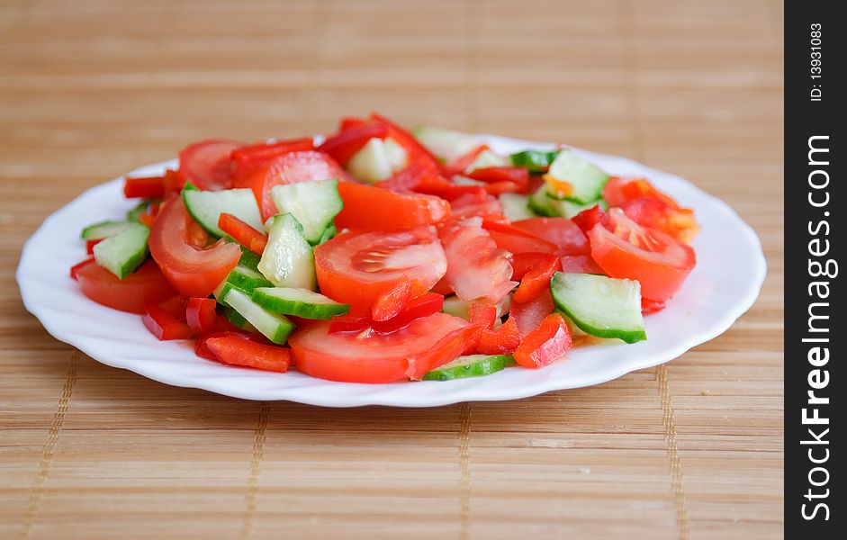 Side dish with green cucumber and red tomato