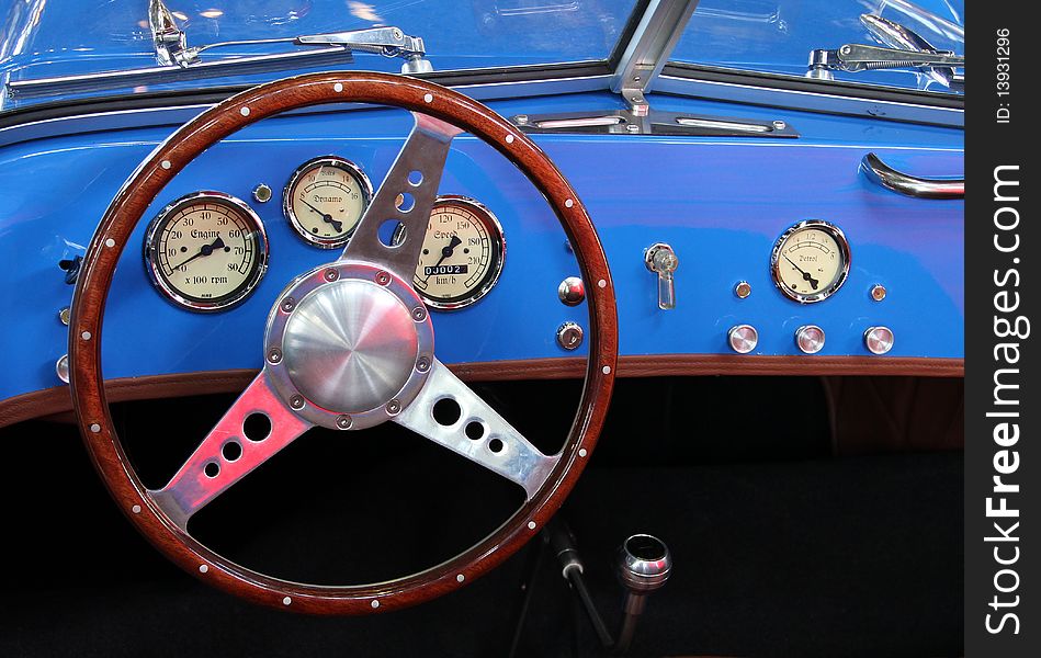 Vintage sports car with blue instrument panel. Vintage sports car with blue instrument panel.