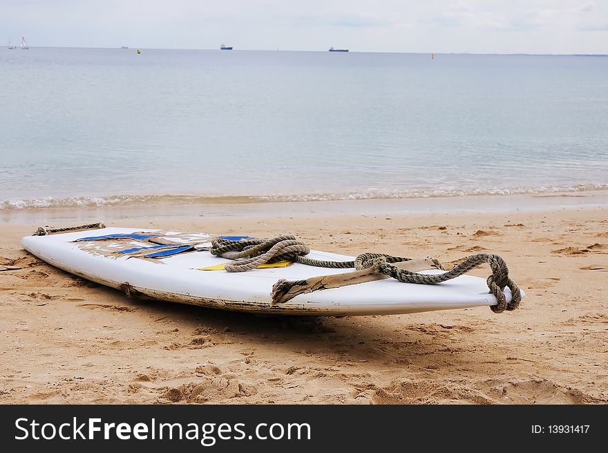 Surfboard on the sand at the beach