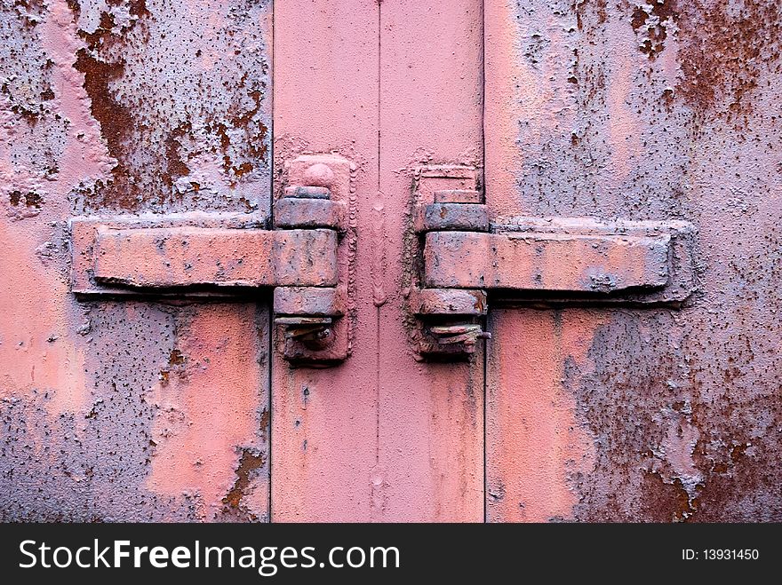 Old rusty metal hinge in the centre